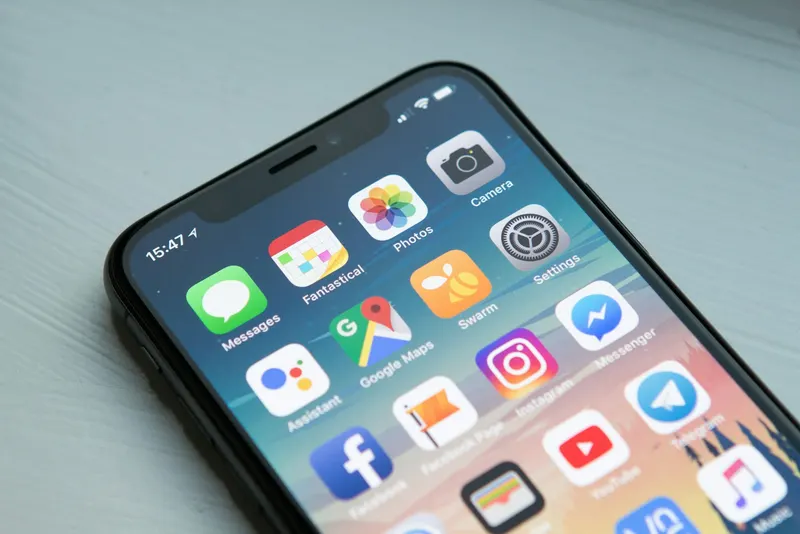 Smartphone displaying digital banking app and rewards points balance